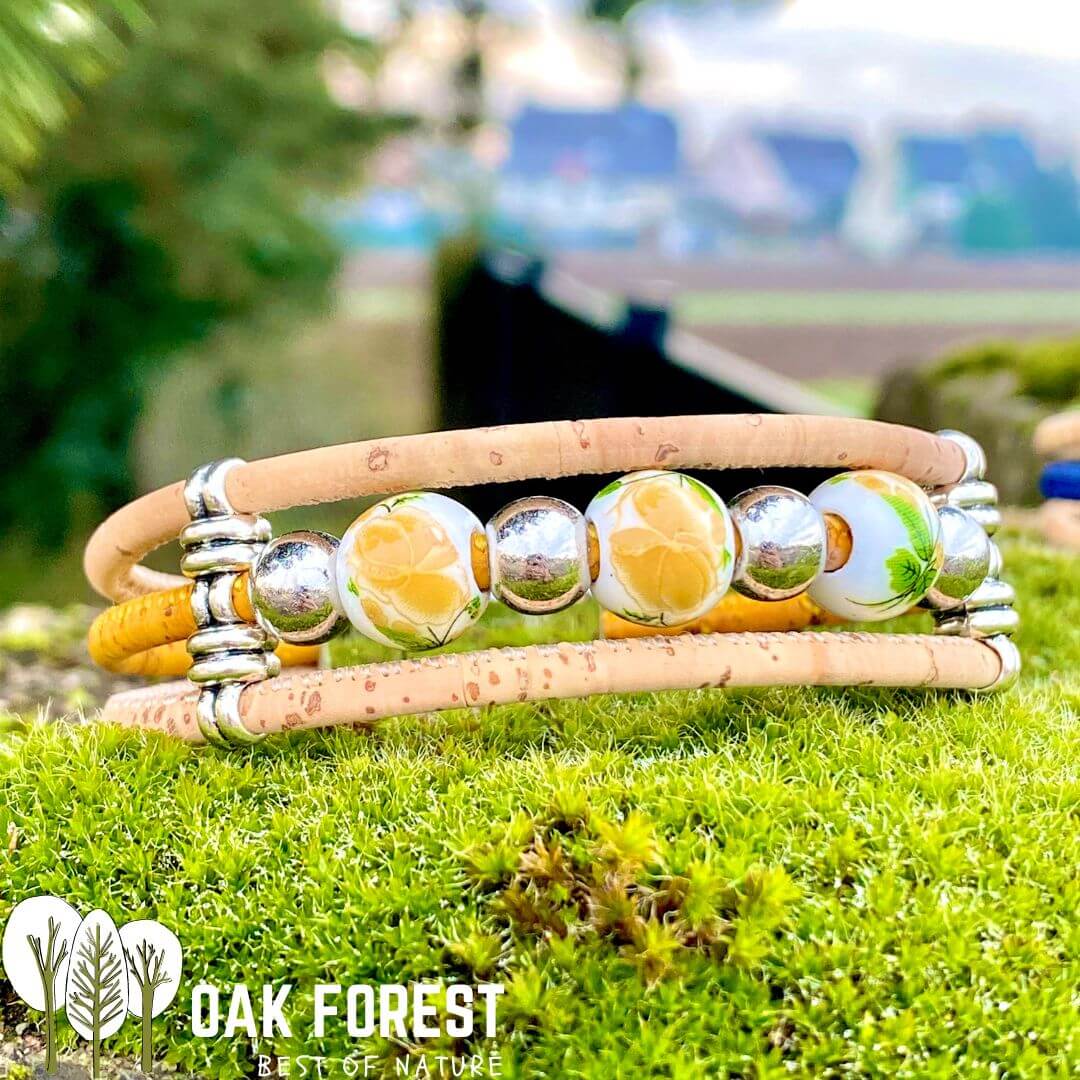 bracelet liege femme vegan - bracelet en liege - bracelet liège portugal - bracelet liège noir et or - bracelet femme noir or - bracelet en liège vegan - bracelet chic - bracelet fleurs femme - bracelet femme été - bracelet fantaisie - idée cadeau femme - anniversaire femme - bracelet coloré vegan - bracelet éthique - ecoresponsable